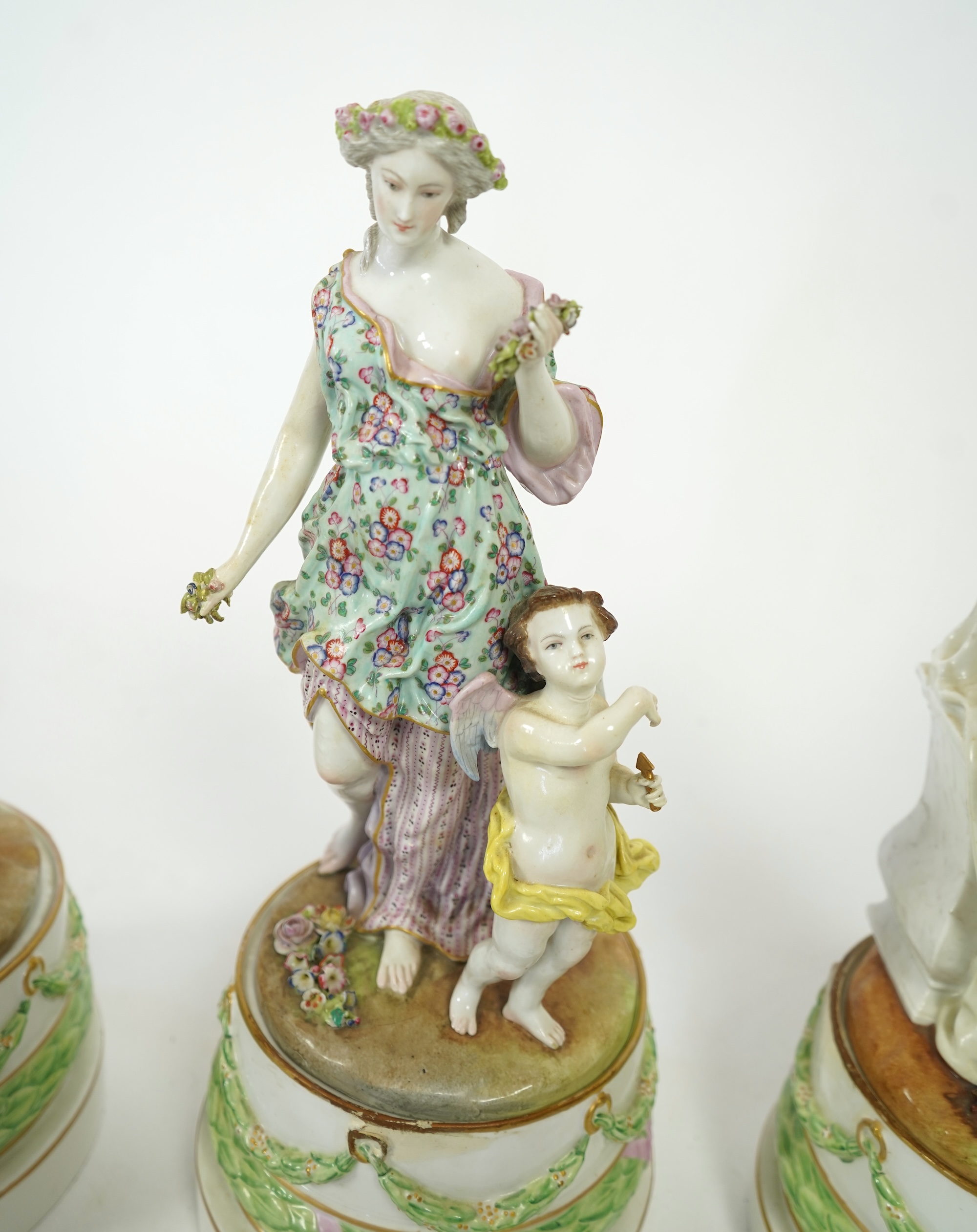 A set of four large Meissen style 'Four Seasons' groups and separate pedestals